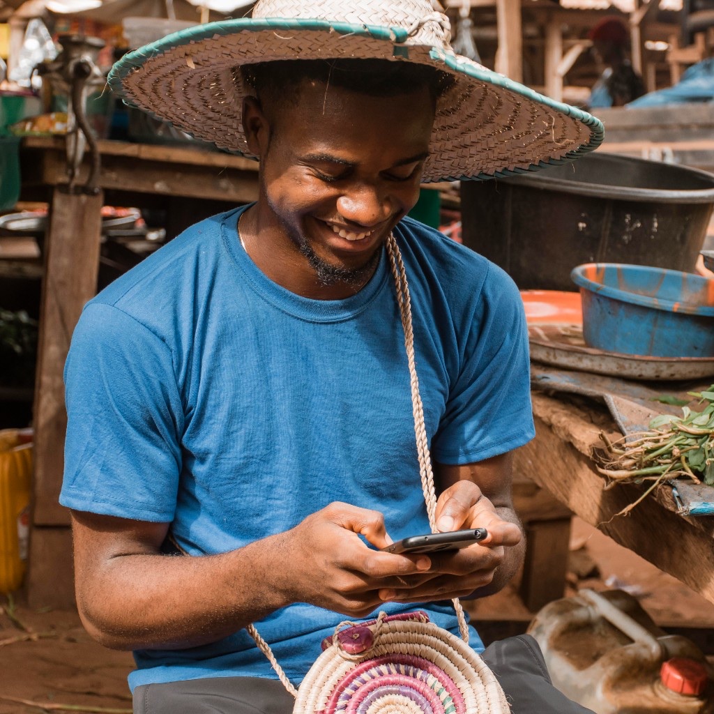 Nigerian service seeker using Findwhosabi on his phone